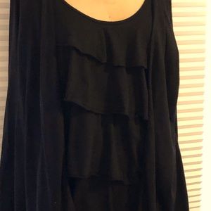 1 piece ruffled top gives the illusion of 2 pc.Ruffled only in front Long sleeve